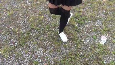 Schoolgirl in Black Knee Socks and White Shoes Show under the Skirt