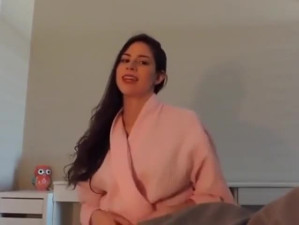 Sexy girlfriend giving a blowjob flashing a bit of