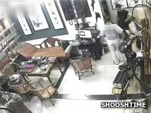Asian Bonnie & Clyde Beat Clerk With Rock