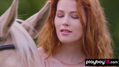 Redhead Latvian diva Heidi Romanova reveals her big natural boobs outdoor
