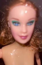 Slutty Barbie gets little extra cum after the main shoot.