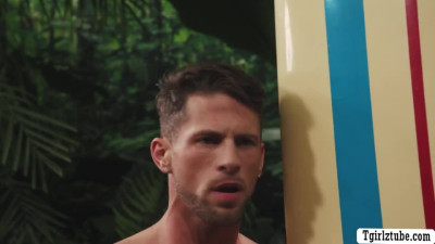 Handsome surfer meets a busty shemale in the jungle,he lets her throat his hard big c