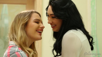 Kenna James and Aria Alexander - Happily Married (2) on a grey bed in lesbian scenes