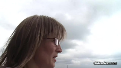 German mature lady Klaudia in nylons plays with her shaved pussy