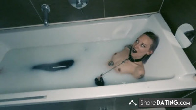 Tattooed BDSM Babe in Latex and Milk Bath