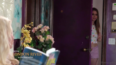 London River and Jill Kassidy on a blue and white patterned bed in lesbian scenes