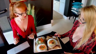 Lucy Gresty and Red (Red XXX) next to and also on a black dining table lesbian scenes